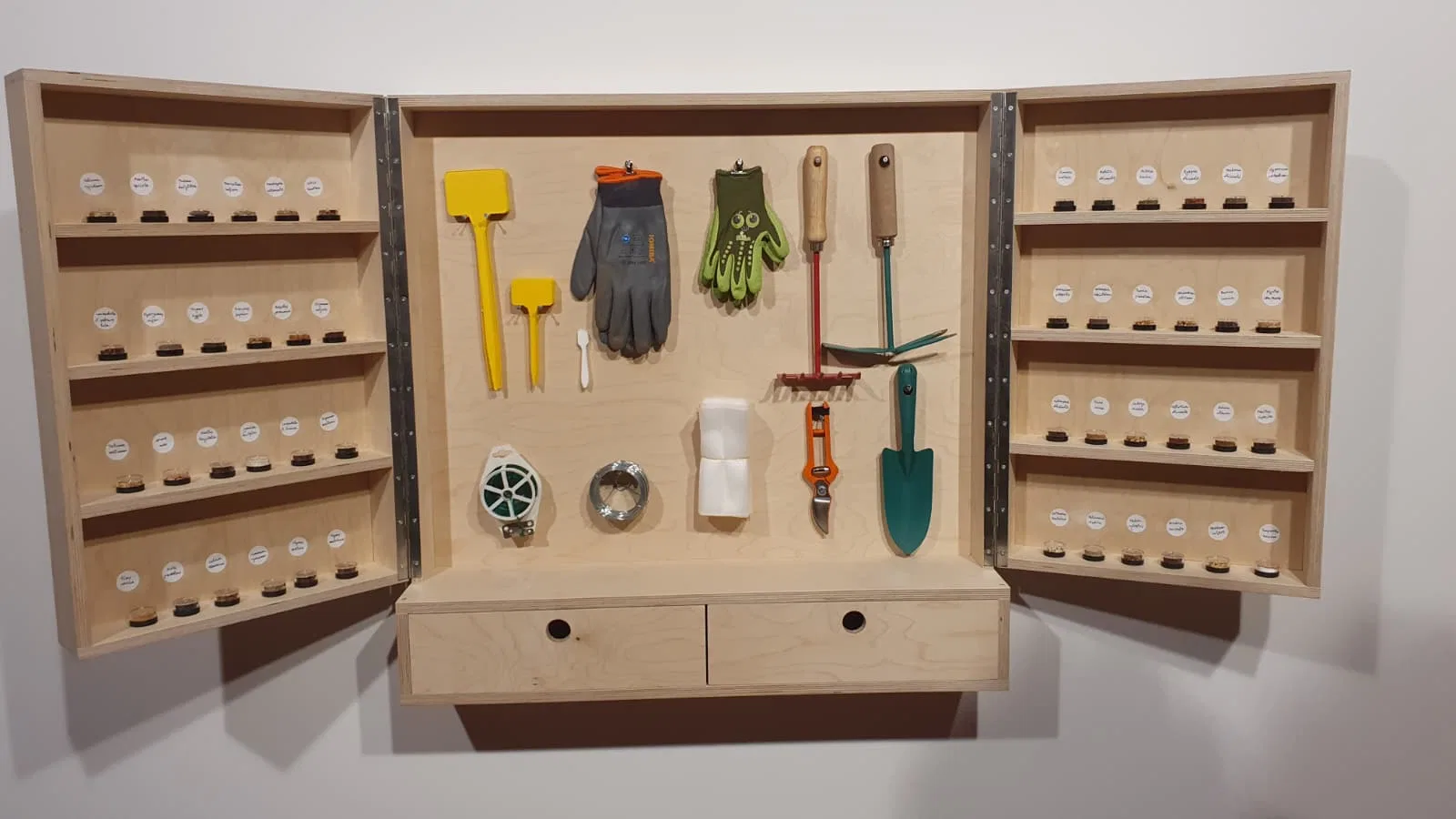 Seed cabinet and gardening tools.