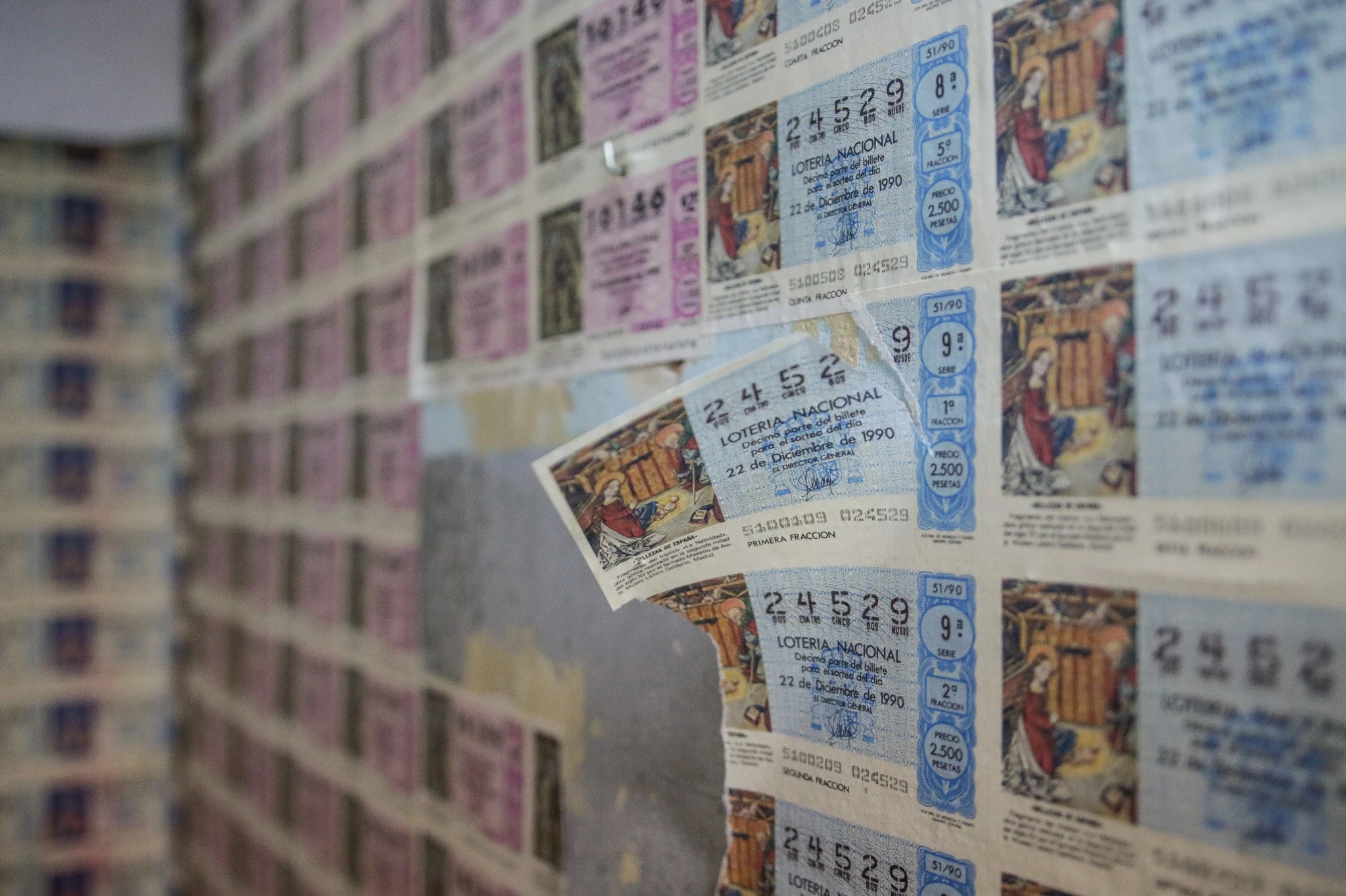 Detail of the original ticket-covered wall.