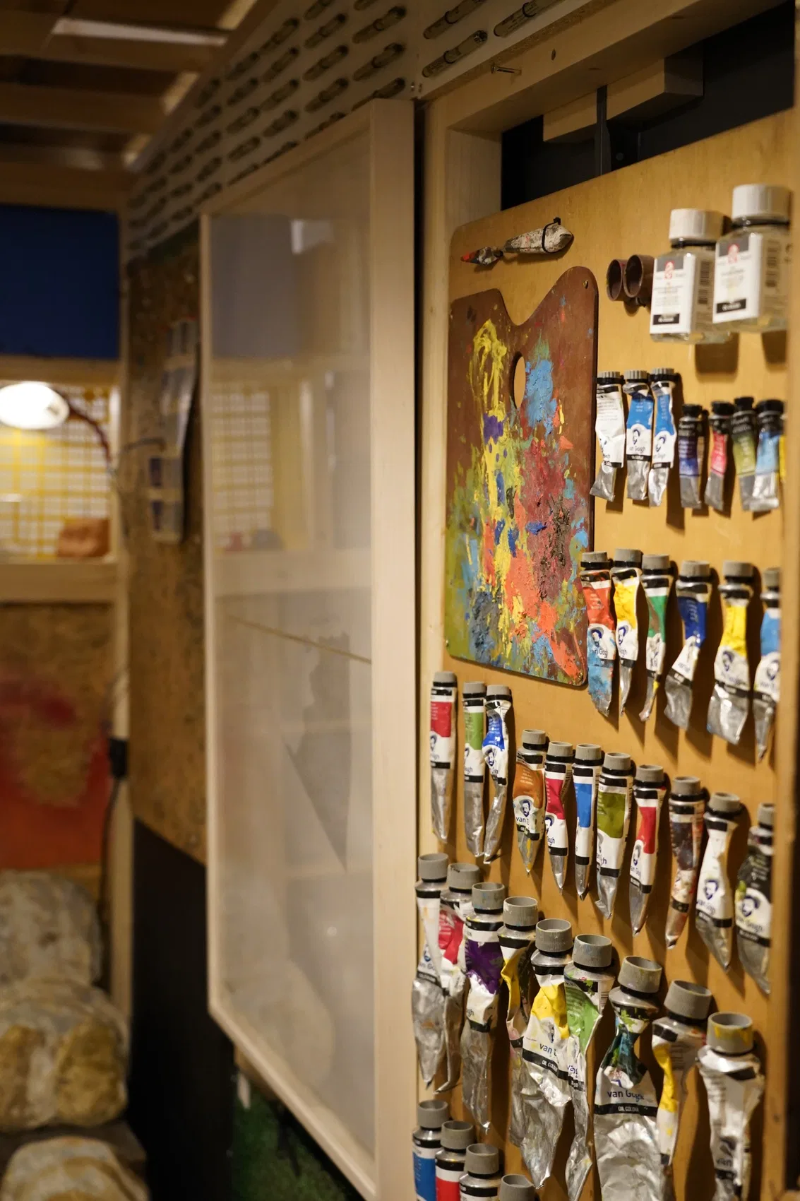 Detail of painting materials and reused objects.